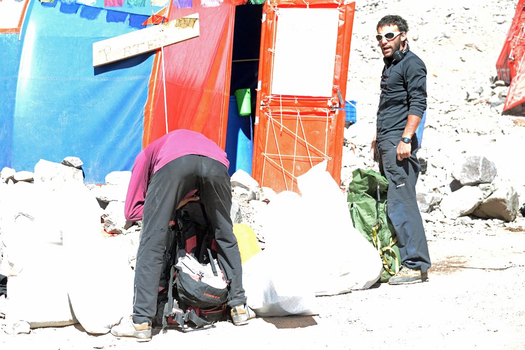 02 Inka Expediciones Porters Nestor And Peluca Pack Their Knapsacks At Plaza Argentina Base Camp 4200m